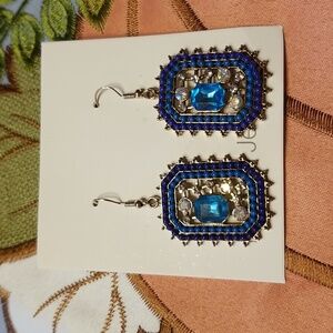 Gorgeous new golden costume earrings with blue accents
